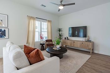 a living room with a couch and a tv